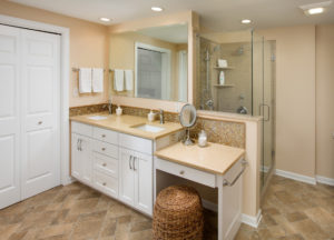 Bathroom remodel tile back splash and dual sinks warm theme