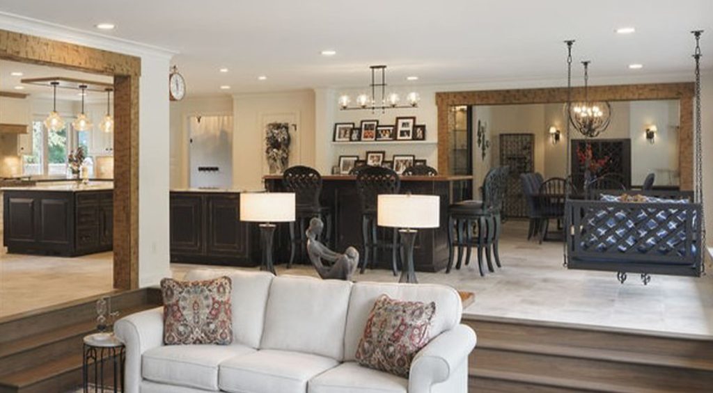 interior of home remodel photographed from the living room which is recessed and open concept so you can see the kitchen and dining area
