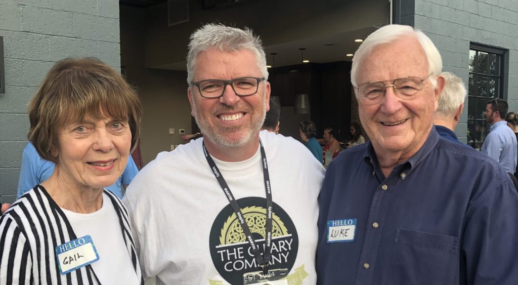 George Cleary pictured in the center with Gail on the left and Luke on the right