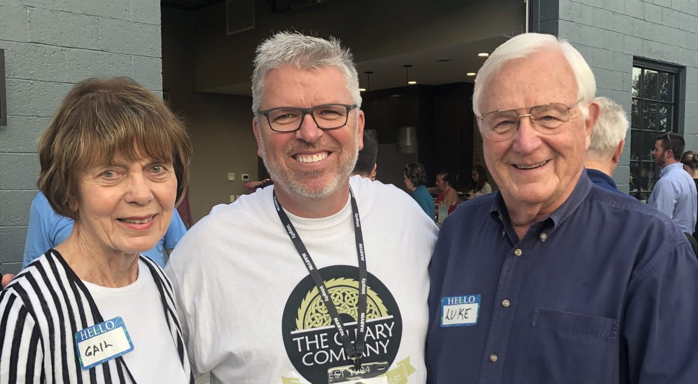 George Cleary pictured in the center with Gail on the left and Luke on the right
